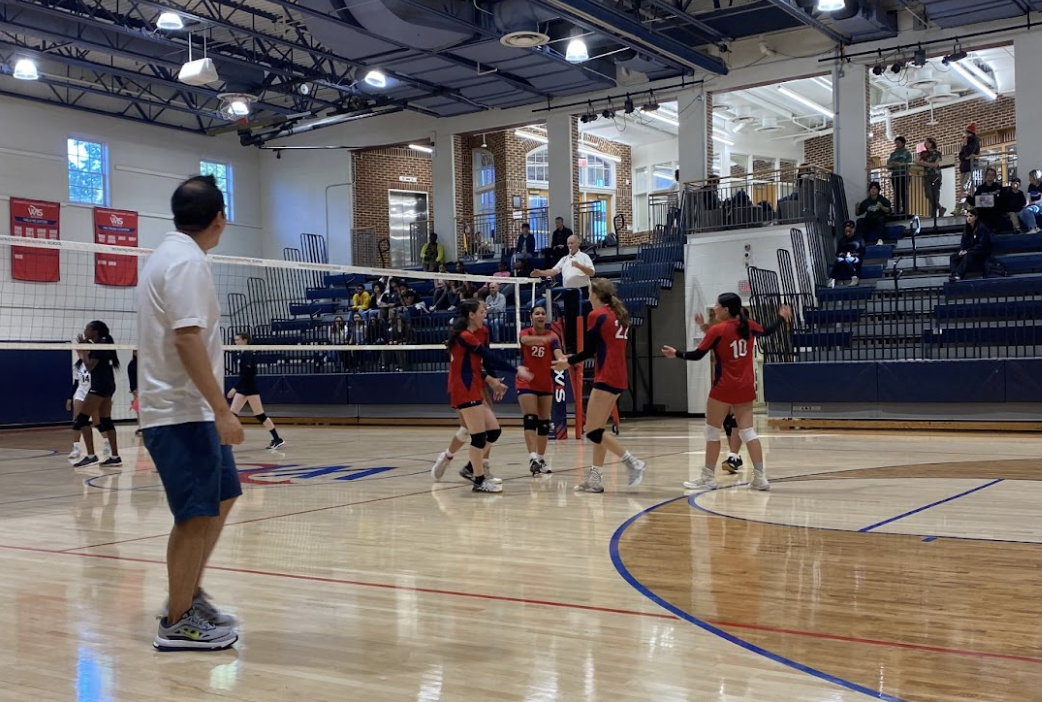 The+Girls+Varsity+Volleyball+team+competing+in+a+PVAC+game.+The+team+illustrates+their+determination+to+secure+a+victory+and+championship+in+the+PVAC+league.+%28Courtesy+of+Shane+Royster%29
